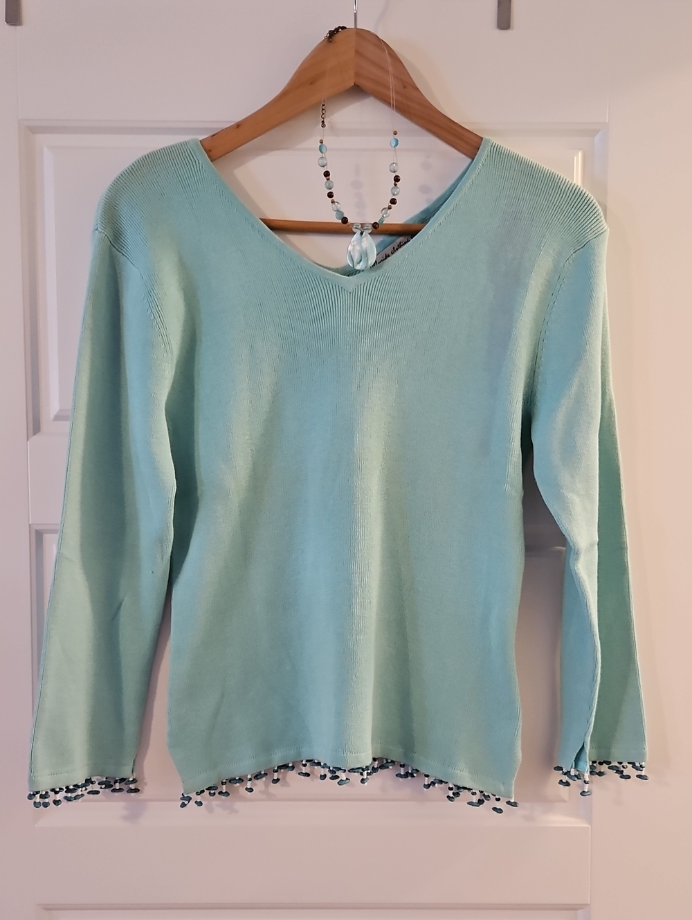 Women’s V-Neck Beaded Hem Sweater in Light Aqua